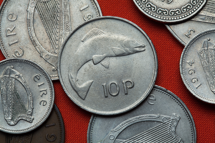 Old 10p Irish coin that includes a salmon